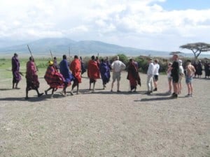 masai showing their dance moves to tourists
