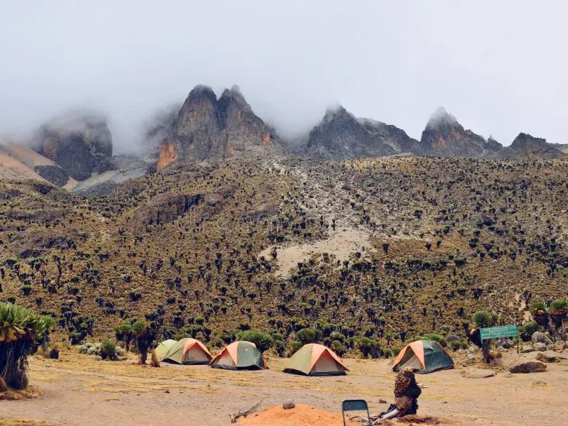 Camping on Climbing Mount Kenya with tents set up under the stars.